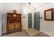 Inviting entryway featuring neutral colors, tile flooring, and a classic wooden hutch at 10031 Bora Bora Dr, Tega Cay, SC 29708