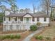 Charming ranch-style home featuring a welcoming front porch and a beautifully landscaped yard at 10031 Bora Bora Dr, Tega Cay, SC 29708