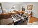Modern kitchen cooktop with stainless steel appliances and a wooden counter overlooking the dining area at 10031 Bora Bora Dr, Tega Cay, SC 29708