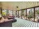 Inviting screened porch with cozy seating to enjoy outdoor living at 10031 Bora Bora Dr, Tega Cay, SC 29708