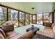 Inviting screened porch with cozy seating to enjoy outdoor living at 10031 Bora Bora Dr, Tega Cay, SC 29708