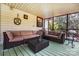 Inviting screened porch with cozy seating to enjoy outdoor living at 10031 Bora Bora Dr, Tega Cay, SC 29708