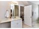 Bathroom featuring a vanity with storage, tile floors, and bright vanity lighting at 1017 Patrick Johnston Ln, Davidson, NC 28036