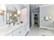 Elegant bathroom with double sinks, a walk-in shower, and ample storage space at 1017 Patrick Johnston Ln, Davidson, NC 28036