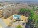 Aerial view of community pool surrounded by mature trees at 1066 Streamlet Way, Monroe, NC 28110