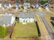 Aerial view of home showcasing the backyard, landscaping, and neighborhood at 1066 Streamlet Way, Monroe, NC 28110