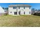 Rear exterior featuring a large grassy yard with a patio at 1066 Streamlet Way, Monroe, NC 28110