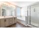 Modern bathroom featuring a double vanity, soaking tub, and glass shower at 1066 Streamlet Way, Monroe, NC 28110