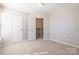 Bright bedroom with open door leading to landing and staircase at 1066 Streamlet Way, Monroe, NC 28110