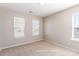 Comfortable bedroom filled with natural light from two large windows at 1066 Streamlet Way, Monroe, NC 28110