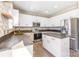 Updated kitchen with stainless steel appliances, white cabinets, and butcher block countertops at 1066 Streamlet Way, Monroe, NC 28110