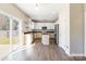 Modern kitchen with white cabinets, stainless steel appliances, and a center island at 1066 Streamlet Way, Monroe, NC 28110