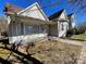 Charming home with a covered porch, vinyl siding, and manicured lawn at 110 2Nd St, Spencer, NC 28159