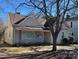 Charming one-story home with a classic design, inviting front porch, and mature tree in the front yard at 110 2Nd St, Spencer, NC 28159