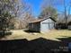 Detached two-car garage with a gray exterior and ample backyard space at 110 2Nd St, Spencer, NC 28159