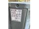 Close up view of a Trane HVAC unit showing the model number, serial number, and power specifications at 110 2Nd St, Spencer, NC 28159