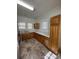 Modern kitchen featuring tile floors, wooden cabinets, ample counter space, and updated appliances at 110 2Nd St, Spencer, NC 28159