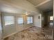 Bright sunroom featuring tile flooring, neutral paint, and great natural light at 110 2Nd St, Spencer, NC 28159