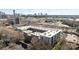 Aerial view of complex with multiple balconies, offering views of the surrounding neighborhood at 1101 W 1St St # 124, Charlotte, NC 28202