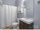 Simple bathroom with vanity, shower, mirror, and a medicine cabinet at 1101 W 1St St # 124, Charlotte, NC 28202