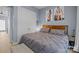 Cozy bedroom with large bed, neutral color scheme, and accent paintings at 1101 W 1St St # 124, Charlotte, NC 28202