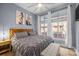 Comfortable bedroom with a king-size bed, soft grey linens, and lots of natural light at 1101 W 1St St # 124, Charlotte, NC 28202