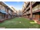 Building courtyard with green space and brick planters offers a serene outdoor setting at 1101 W 1St St # 124, Charlotte, NC 28202