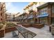 Community courtyard features grilling areas, picnic tables, and brick planters at 1101 W 1St St # 124, Charlotte, NC 28202