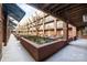 Beautiful courtyard with decorative brick planters, walking paths, and seating areas at 1101 W 1St St # 124, Charlotte, NC 28202