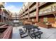 Outdoor courtyard with brick accents, featuring a grilling area and picnic table seating for residents at 1101 W 1St St # 124, Charlotte, NC 28202