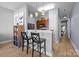 Bright kitchen with modern lighting, bar seating, and wood cabinets, perfect for entertaining at 1101 W 1St St # 124, Charlotte, NC 28202