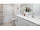 Bathroom featuring a double vanity, bathtub, shower and neutral decor, with modern fixtures at 11205 Cardinal Creek Ave, Charlotte, NC 28215