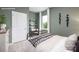 Comfortable bedroom includes a metal frame bed, green walls, and a small desk providing a peaceful atmosphere at 11205 Cardinal Creek Ave, Charlotte, NC 28215