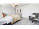 Spacious bedroom with neutral colors, a dresser, and a gray accent chair with a comfortable cushion at 11205 Cardinal Creek Ave, Charlotte, NC 28215