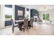 Open dining area showcases a table with seating, a fireplace, and a sliding door with backyard access at 11205 Cardinal Creek Ave, Charlotte, NC 28215