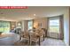 Elegant dining area with large windows and views of the outdoors at 11205 Cardinal Creek Ave, Charlotte, NC 28215