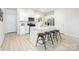 Bright kitchen boasts a central island with bar stool seating, creating a casual dining space at 11205 Cardinal Creek Ave, Charlotte, NC 28215