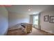 Cozy living room features a table, two chairs, and a bright window with patterned curtains at 11205 Cardinal Creek Ave, Charlotte, NC 28215