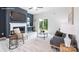 Bright living room featuring a fireplace, stylish furniture, and a sliding glass door to the outside at 11205 Cardinal Creek Ave, Charlotte, NC 28215