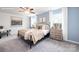 Spacious main bedroom featuring a ceiling fan, large windows, and neutral tones perfect for relaxation at 11205 Cardinal Creek Ave, Charlotte, NC 28215