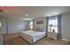 Relaxing main bedroom with plush bedding and decor art on the walls at 11205 Cardinal Creek Ave, Charlotte, NC 28215