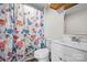 Bathroom featuring a colorful shower curtain, white vanity with sink, and a mirror at 114 Glen Rae Sw St, Concord, NC 28025