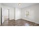 Bedroom with wood-look flooring, natural light and closet at 114 Glen Rae Sw St, Concord, NC 28025
