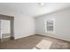 Bedroom features neutral carpet and natural light at 114 Glen Rae Sw St, Concord, NC 28025