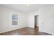 Bedroom with wood-look flooring, natural light and closet at 114 Glen Rae Sw St, Concord, NC 28025