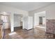 Bright kitchen features hardwood floors, white appliances, and ample natural light at 114 Glen Rae Sw St, Concord, NC 28025