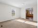 Cozy living room with neutral carpet and a view into the adjacent kitchen at 114 Glen Rae Sw St, Concord, NC 28025
