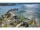 Stunning aerial view of waterfront homes with boat docks on Lake Norman, NC, offering picturesque lakeside living at 127 Lakewood Circle Dr, Mooresville, NC 28117