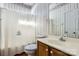 Bathroom featuring striped wallpaper, a white shower curtain, a toilet, and a white single sink vanity at 127 Lakewood Circle Dr, Mooresville, NC 28117