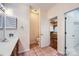 Bathroom showcasing the toilet with a sink and vanity featuring wood cabinets and tile flooring at 127 Lakewood Circle Dr, Mooresville, NC 28117